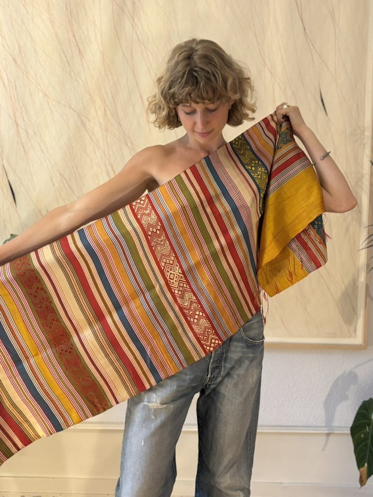 More pieces from the collection: plant-dyed silk scarves and antique Dao textiles